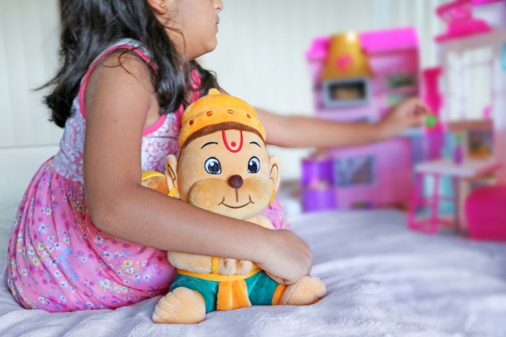 A Girl With Hanuman Plush Toy